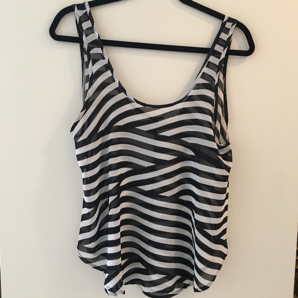 Sheer, flowy sleeveless black and white top